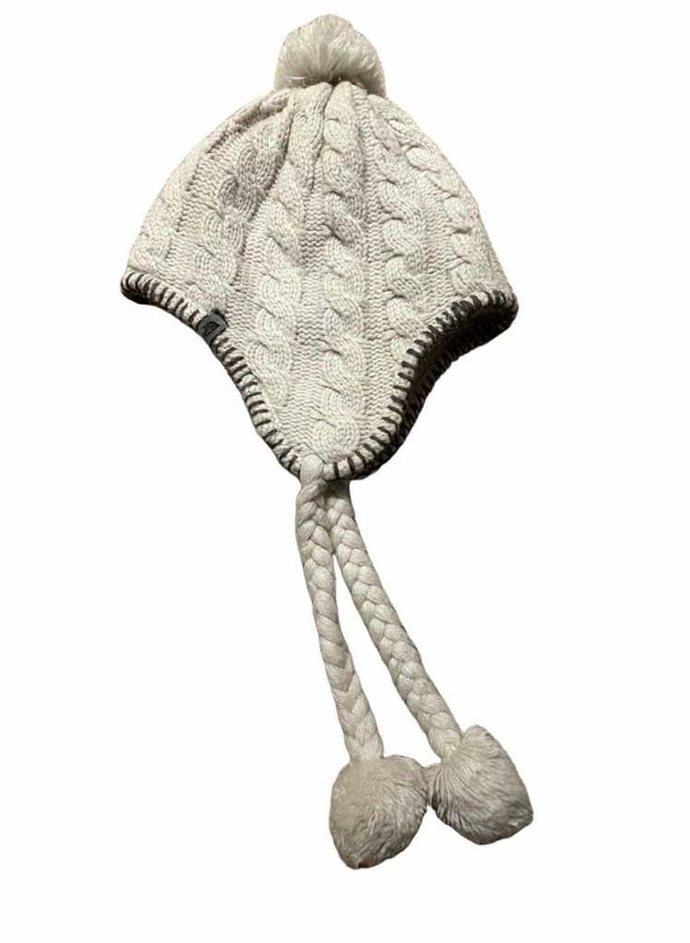 The North Face Cream Cable Knit Fleece Lined Earflap Hat With Braided Tassels